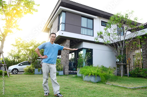 Asian man and his new house