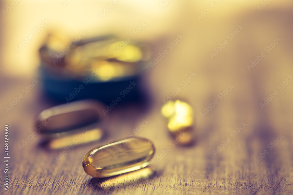 Fish oil capsules with omega 3 and vitamin D. Healthy diet concept Fish oil capsules with omega 3 and vitamin D. Healthy diet concept