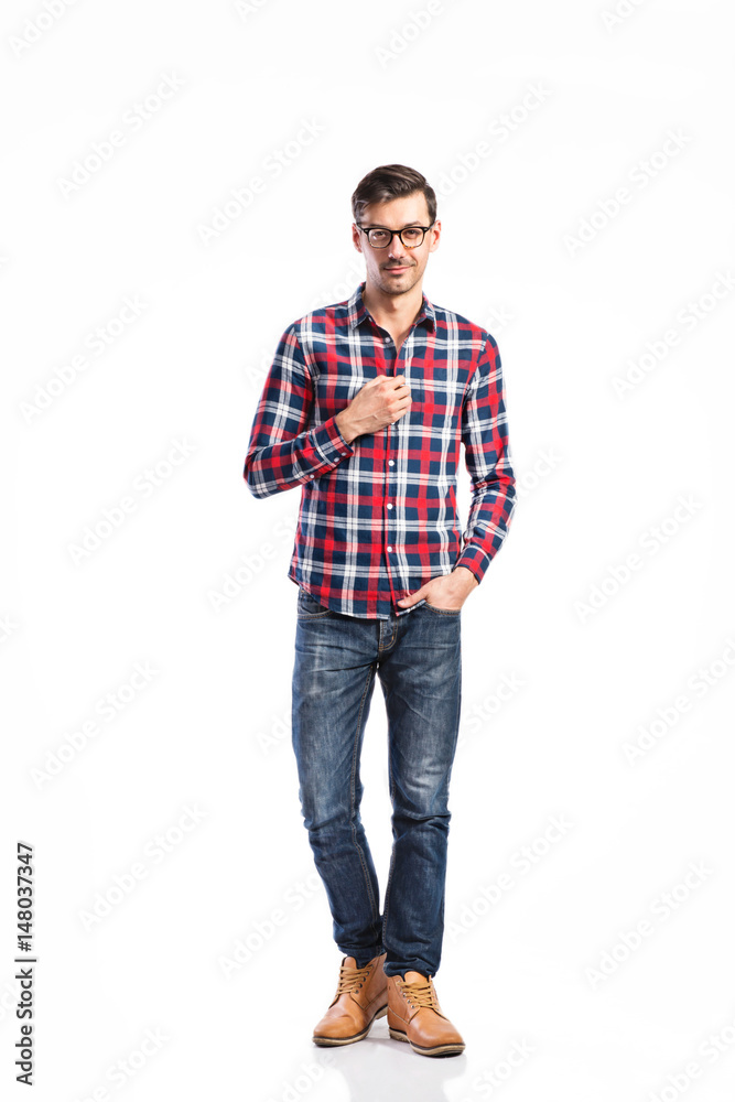 Fototapeta premium Handsome man in checked shirt, studio shot, isolated