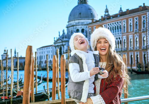 mother and child travellers in Venice with digital photo camera © Alliance