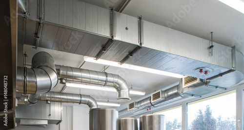 Foto Ventilation pipe system in kitchen interior.