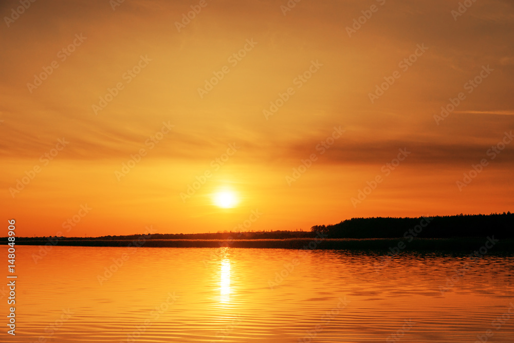orange sunset over river