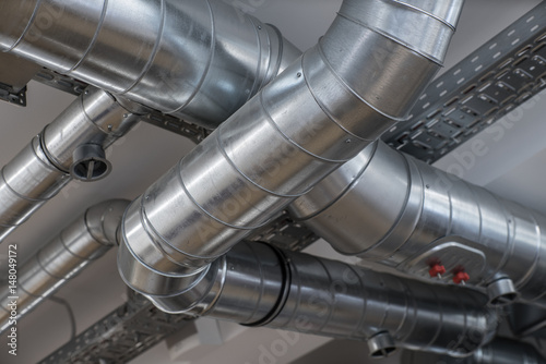 Foto Ventilation pipe system in kitchen interior.