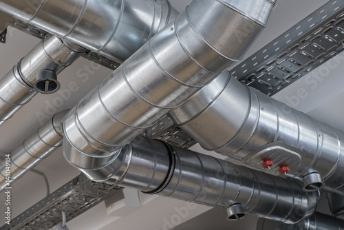 Fototapete Ventilation pipe system in kitchen interior.