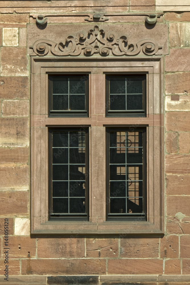 Beautiful ornamental old window in the wall of the castle. Beautiful ornamental old window in the wall of the castle.