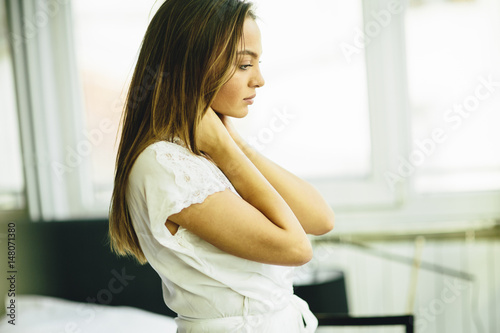 Obraz na plátně Young woman relaxing in the room after waking up