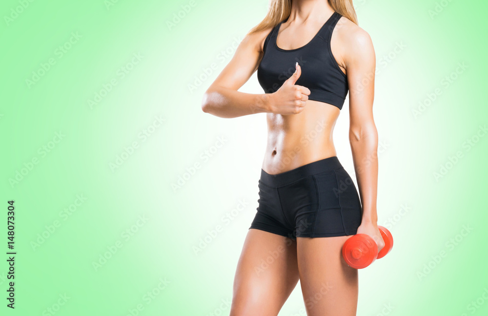 Fit, healthy and sporty woman in sportswear over green background. Fit, healthy and sporty woman in sportswear over green background.