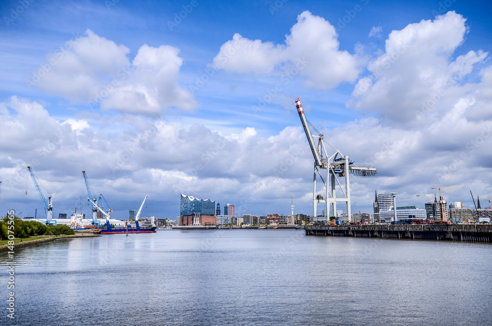 Hamburg, view of the hafencity with Elbphilharmonie and Michel and Big Crane at the pier