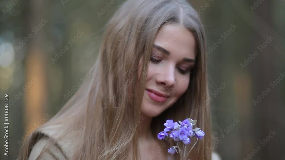 The girl in the Park admiring the snowdrops The girl in the Park admiring the snowdrops