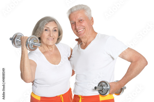 Beautiful elderly couple in a gym 