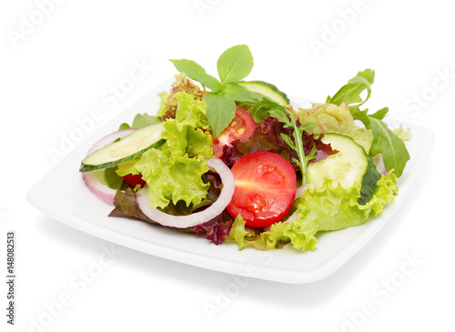 Vegetarian salad with fresh vegetables isolated on white