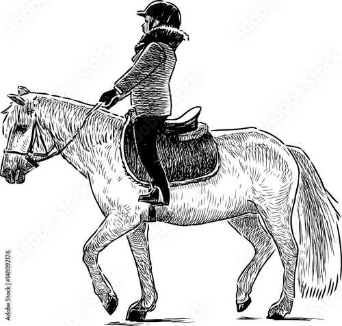 A child riding a horse