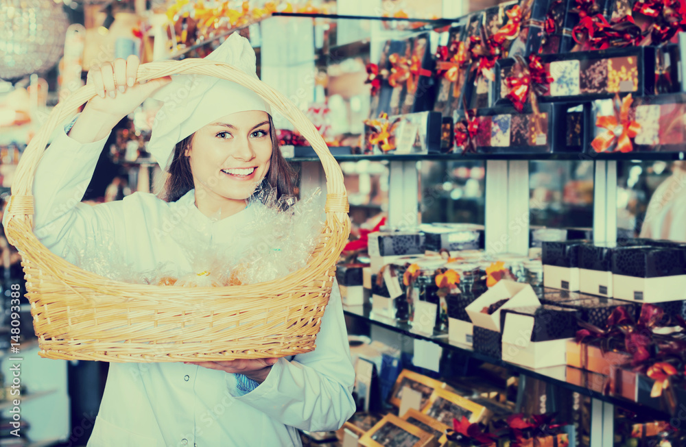 shopgirl posing with delicious ganaches, praline and chocolates