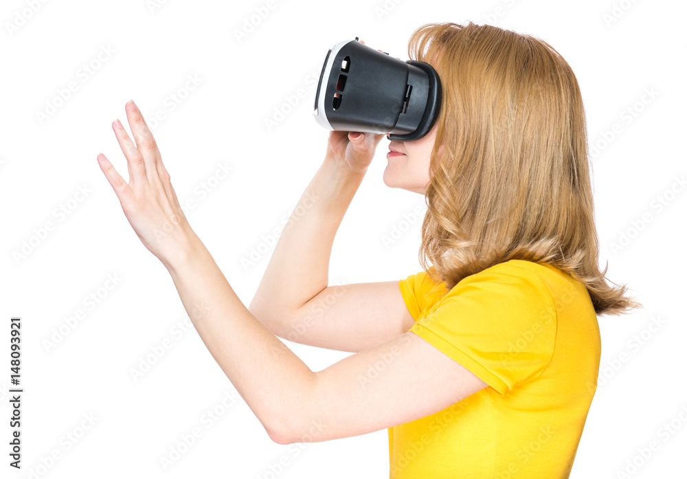 Side view portrait of woman wearing virtual reality goggles watching movies or playing video games on white. Profile of girl getting experience using VR-headset glasses of virtual reality. Side view portrait of woman wearing virtual reality goggles watching movies or playing video games on white. Profile of girl getting experience using VR-headset glasses of virtual reality.