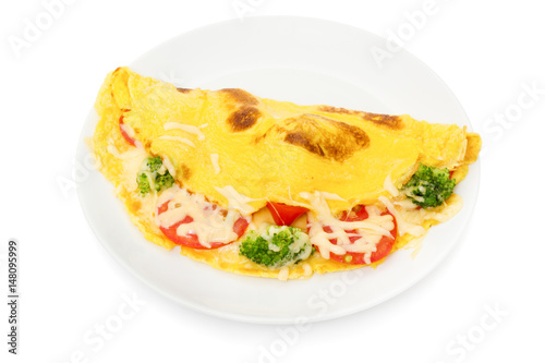 omelet with cheese, broccoli and tomatoes on white