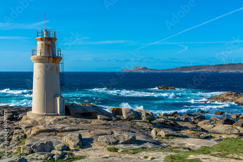 Seaside View of Lightshouse Against Ocean and Cape Vilano photo