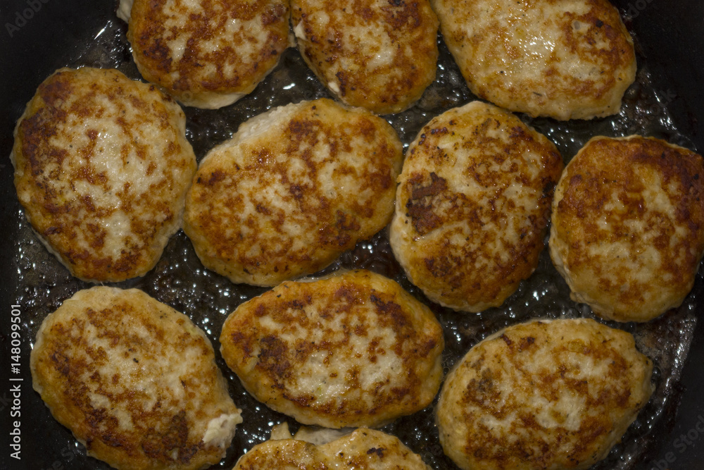 Homemade cutlets background in boiling oil Homemade cutlets background in boiling oil