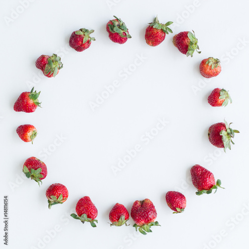 Oval frame of strawberries on white background. Flat lay, top view. Size 1x1