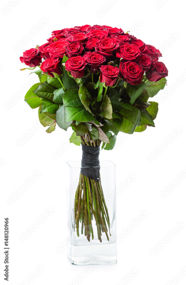 Obraz premium Bouquet of red roses in glass vase