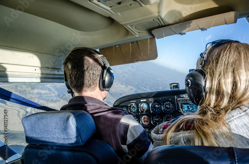 two people flying a plane