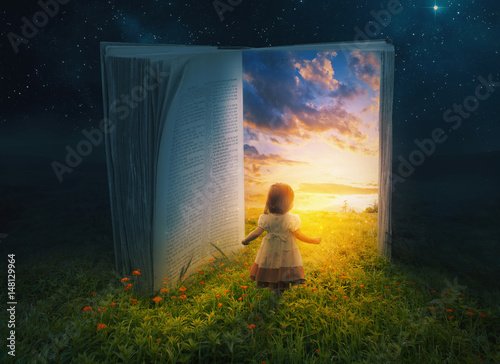 Little girl and open book