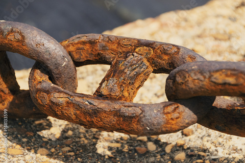 Extreme Close-Up Of Rusty Chain In Greek Port © Radu Bighian