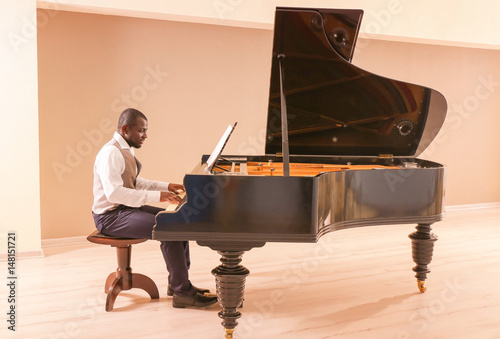 Photography Afro American man playing piano