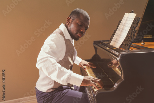 Afro American man playing p...
