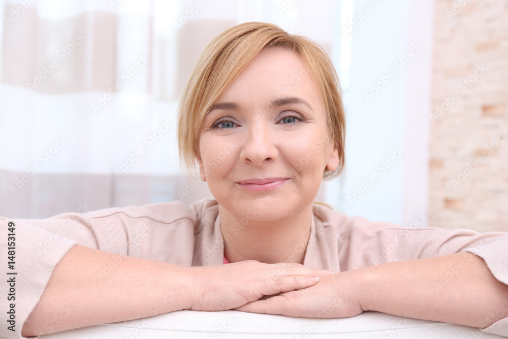 Happy senior woman on light background at home Happy senior woman on light background at home