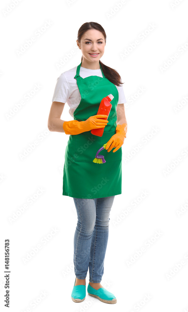 Young woman holding cleaning supplies on white background