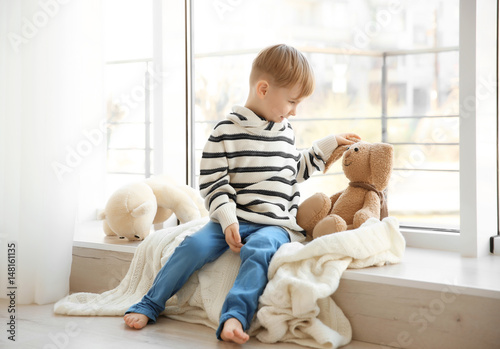 Cute little boy sitting on ...