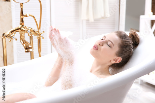 Beautiful young woman takin...