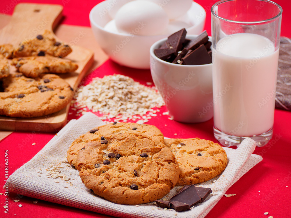 Round cookies with chocolate on the red table Round cookies with chocolate on the red table