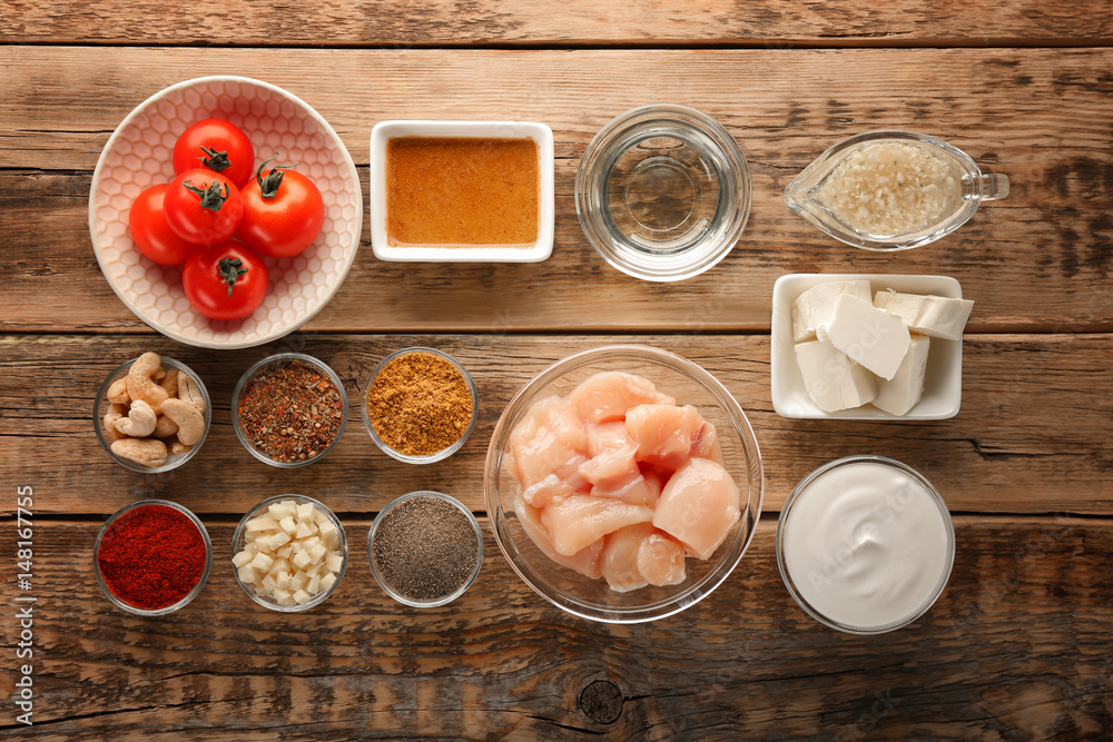 Ingredients for Murgh Makhani on wooden background Ingredients for Murgh Makhani on wooden background