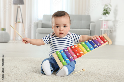 Cute little baby with xylop...