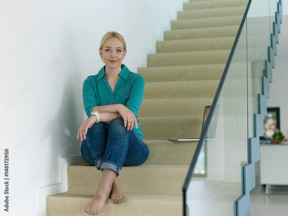 portrait of a young beautiful woman on the stairs portrait of a young beautiful woman on the stairs