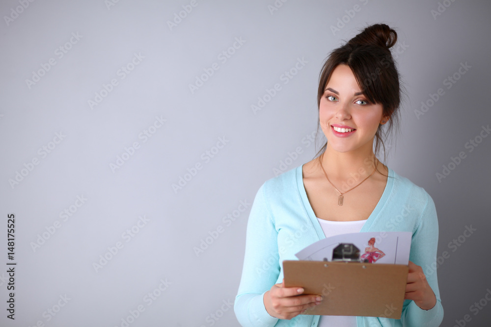 Woman with folder for documents on gray background Woman with folder for documents on gray background