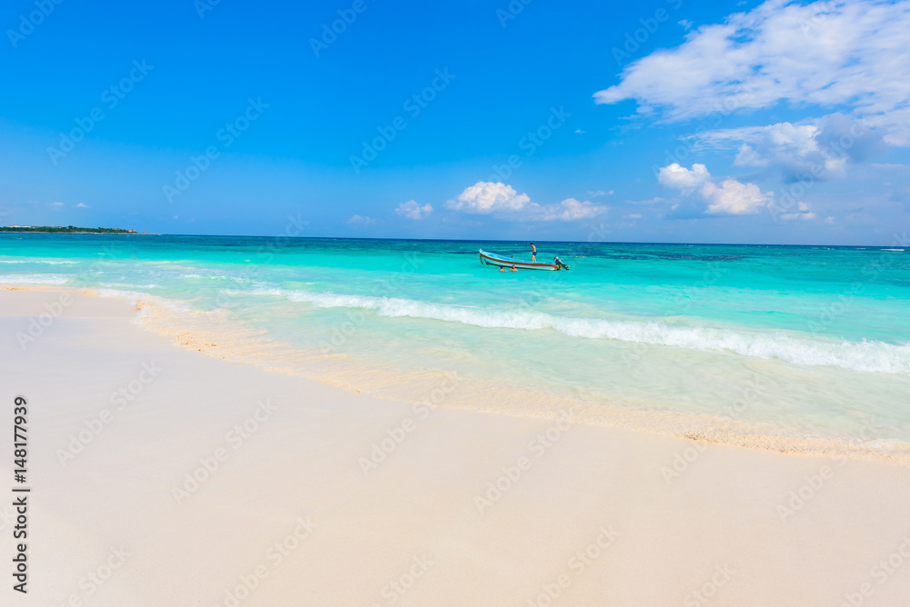 Xpu-Ha Beach - boat at beautiful caribbean coast of Mexico - Riviera Maya Xpu-Ha Beach - boat at beautiful caribbean coast of Mexico - Riviera Maya