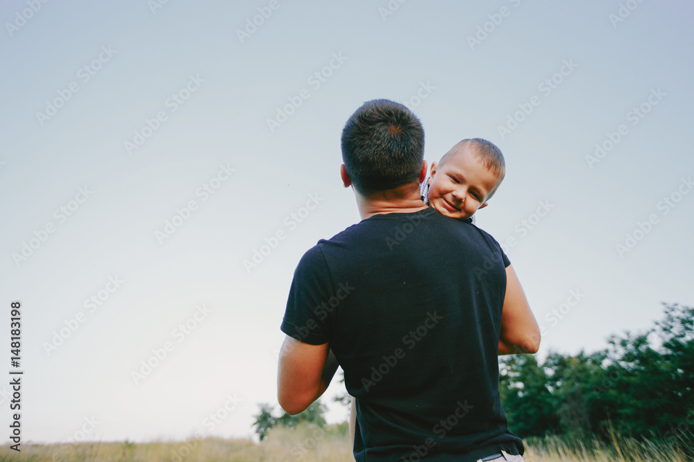 Naklejka premium young family with a child have fun outdoors