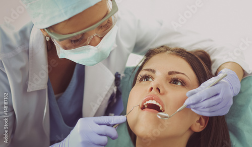 Woman dentist working at her patient amp amp amp  39 s teeth