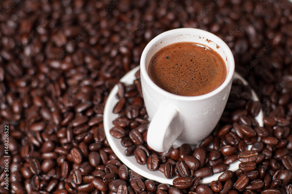Coffee cup and coffee beans on table Coffee cup and coffee beans on table