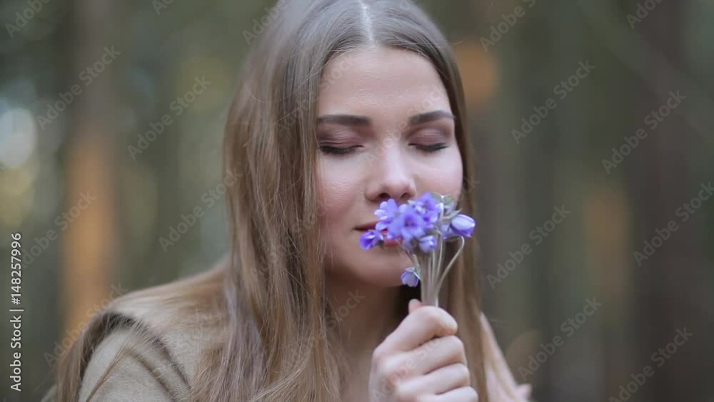 The girl in the Park admiring the snowdrops The girl in the Park admiring the snowdrops