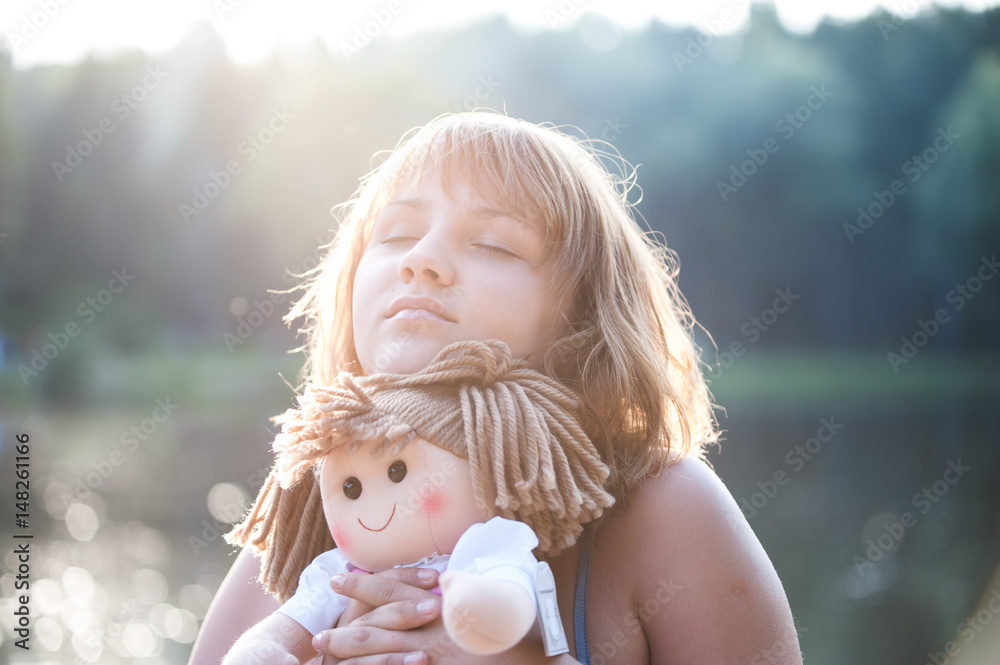 girl with a doll in his hands in dreams girl with a doll in his hands in dreams