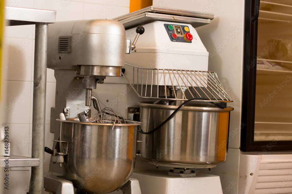 Two complete bread Mixer In Bakery, mixing dough for baguettes in a bakery machine for mixing dough Two complete bread Mixer In Bakery, mixing dough for baguettes in a bakery machine for mixing dough