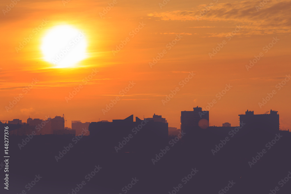 Sunrise and silhouette of modern city