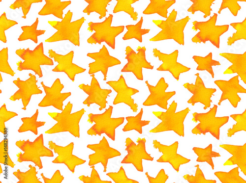 Seamless pattern with small golden yellow and orange stars painted in watercolor on white isolated background