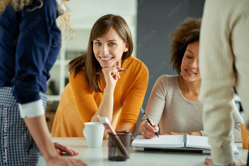 Young people working in modern office, brainstorming together Young people working in modern office, brainstorming together