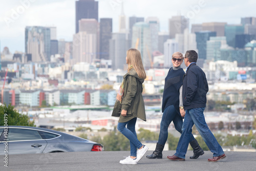 Happy family crossing the street in San Francisco
