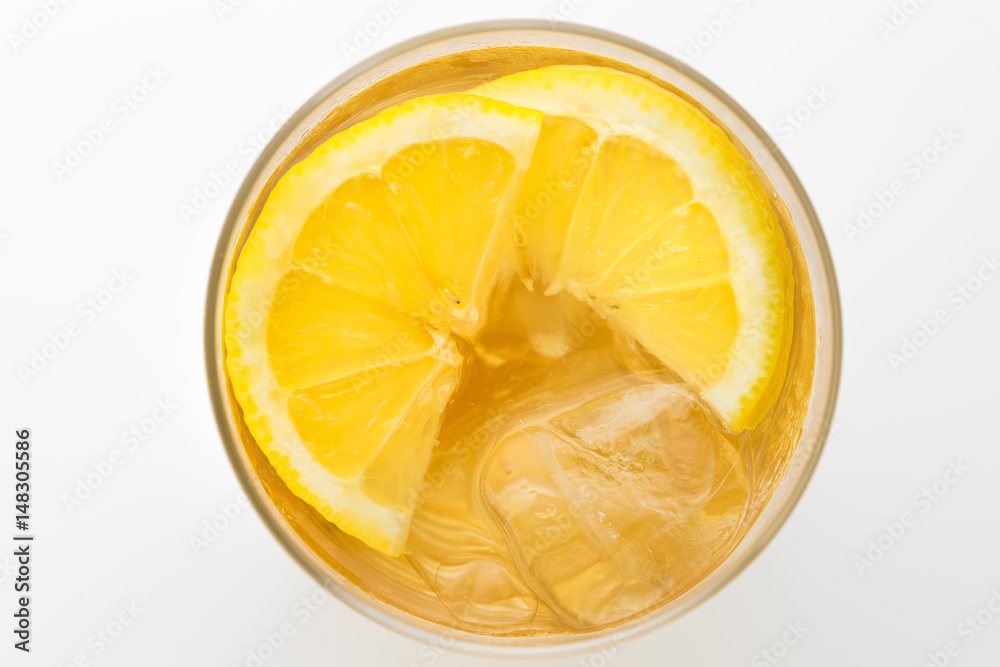 Glass of lemon ice tea isolated on white background. From top view Glass of lemon ice tea isolated on white background. From top view