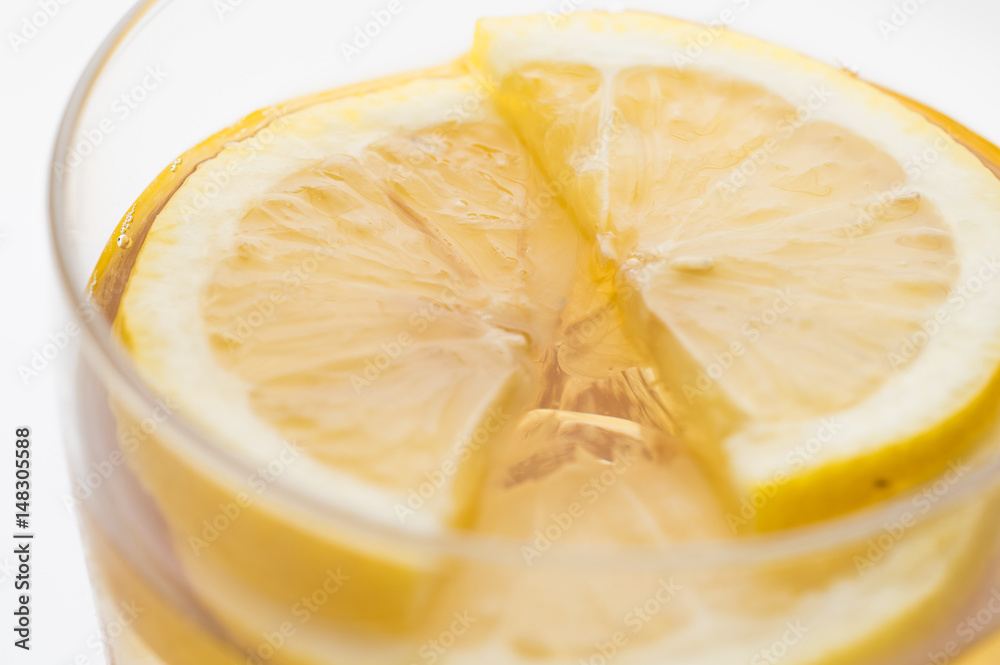 Glass of lemon ice tea isolated on white background. close up Glass of lemon ice tea isolated on white background. close up